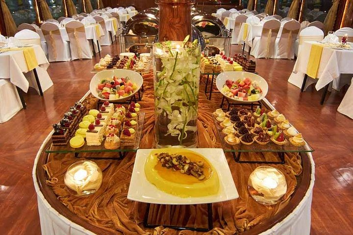 Indulge in an exquisite open buffet dinner on a traditional dhow witnessing stunning sights of Dubai Marina’s architecture and vibrant markets while enjoying quality time with loved ones.